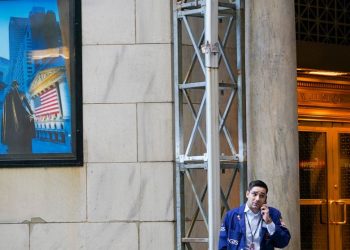 Asian shares sharply lower after a wobbly day on Wall Street