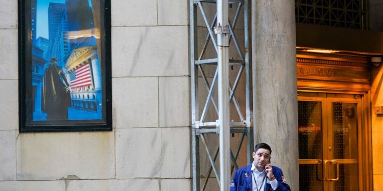 Asian shares sharply lower after a wobbly day on Wall Street