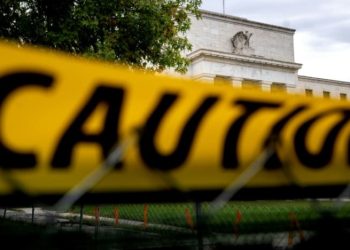 Dow sinks more than 500 points in whiplash trading session after Fed raises interest