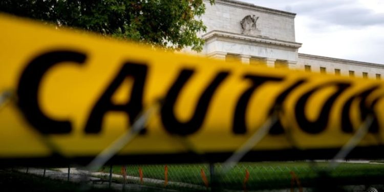 Dow sinks more than 500 points in whiplash trading session after Fed raises interest