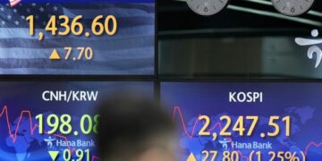 Asian shares mostly gain after rallying on Wall Street