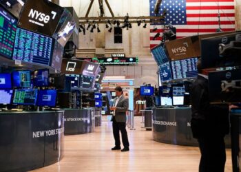 Asian shares are mostly lower as Japan preps massive stimulus