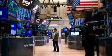 Asian shares are mostly lower as Japan preps massive stimulus