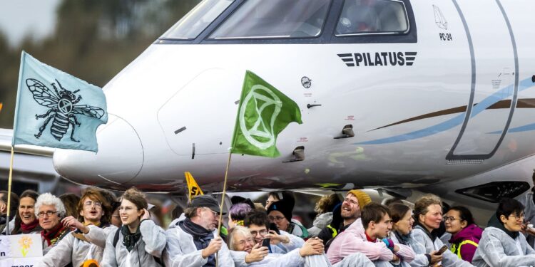 Climate activists block private jets at Amsterdam airport