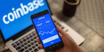 Coinbase cuts Q3 losses in half