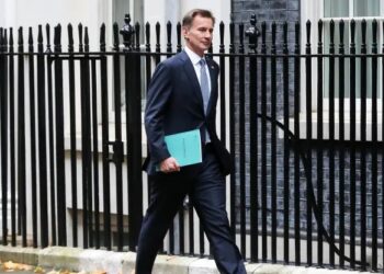 UK finance minister announces tax hikes and spending cuts, says the country is in recession