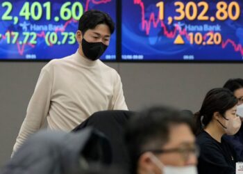 Asian shares lower as strong data hit hopes for dovish Fed