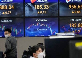 Asian shares gain after Fed chair signals slower rate hikes