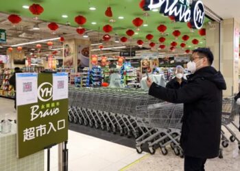 China eases Covid restrictions on travel and production