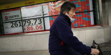 Global markets mixed, headed for annual loss