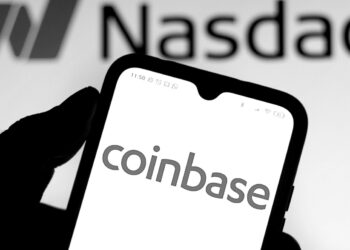 Coinbase Q4 revenue and earnings beat expectations, but transaction volume falls 12% from Q3