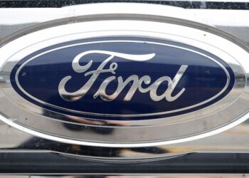 Ford 4Q profit drops 90%, company says more cost cuts coming