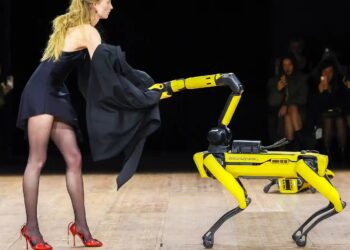 Models and robots share the runway at the Coperni fashion show