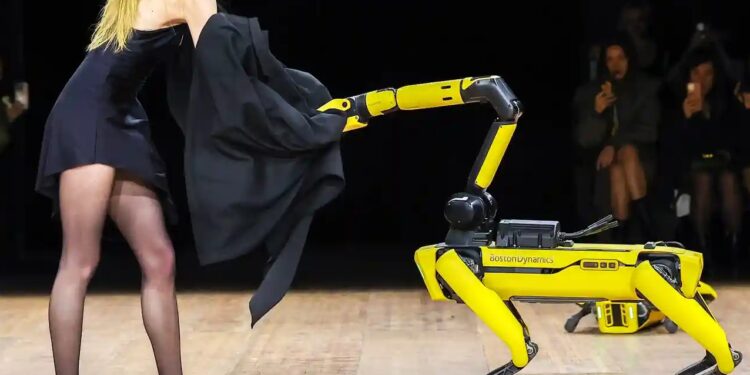 Models and robots share the runway at the Coperni fashion show