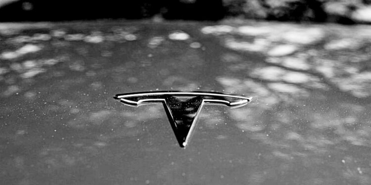 Tesla says it will cut costs of next-generation cars in half