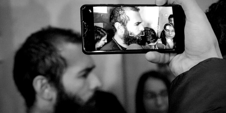 Andrew Tate: out of jail, straight onto his phone