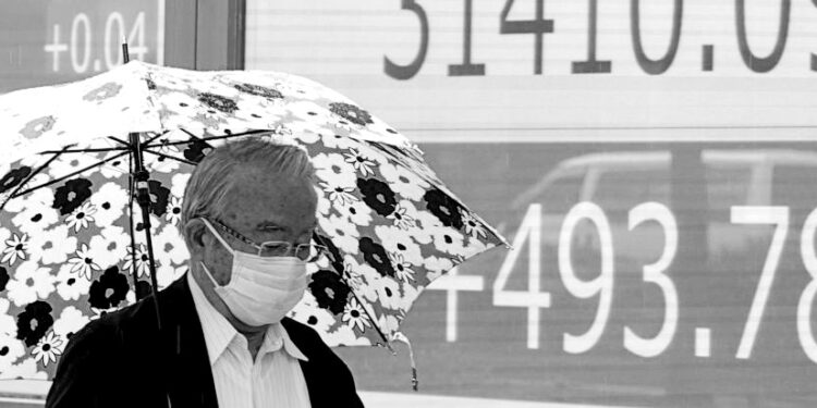 Asian markets mostly higher after Biden-McCarthy deal on US debt