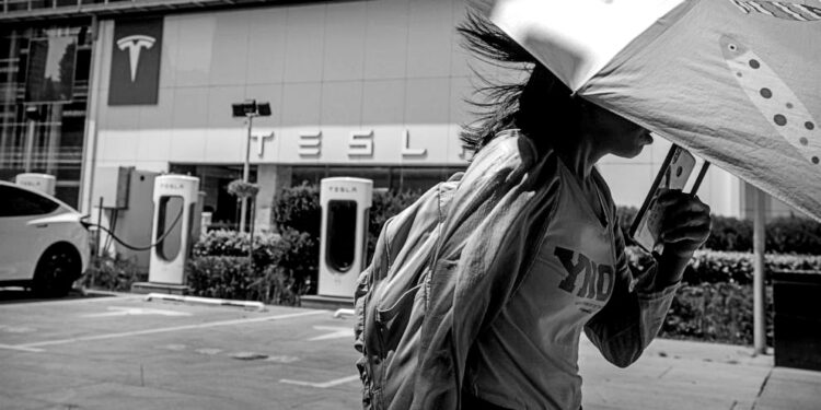 Threatened by shortages, electric car makers race for supplies of lithium for batteries