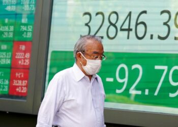 Asian shares mostly lower amid selling of China property shares