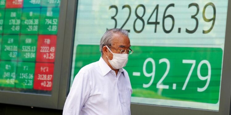 Asian shares mostly lower amid selling of China property shares