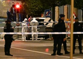 Gunman who shot dead two Swedish football fans in Brussels remains at large, PM says