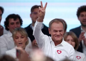Poland exit polls: Donald Tusk claims victory based on coalition hopes