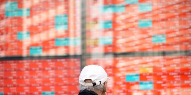 Asian shares mixed after Wall Street gains, Hong Kong stocks near 15-month low