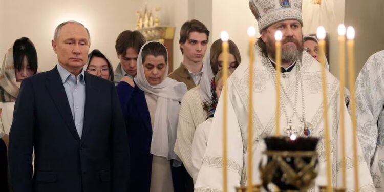 On Orthodox Christmas Putin vows to back soldiers who ‘defend’ Russia