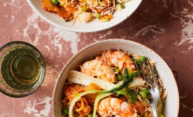 Rukmini Iyer’s quick and easy recipe for kimchi fried rice with peas, prawns and pak choi