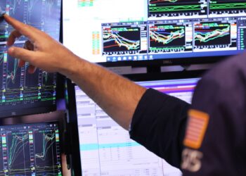 On this day in 1997: The Dow Jones Industrial Average first eclipsed the 7,000 mark, then closed at 7,022.44.