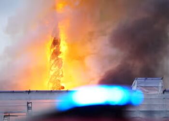 The historic building The Stock Exchange in Copenhagen is on fire – the spire has collapsed