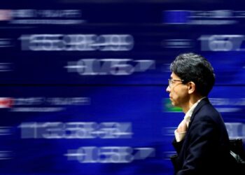 Japanese stocks rise, yen slides after BOJ’s cautious stance