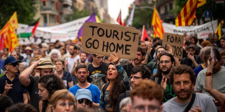 Drunk visitors, rocketing rents and homogenised cafes: living in Europe’s tourist hotspots