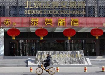 Shares dither, dollar firm on trade war risk