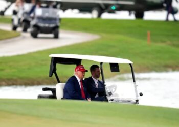 As stock market plunges over tariffs, Trump takes in the greens at his golf course