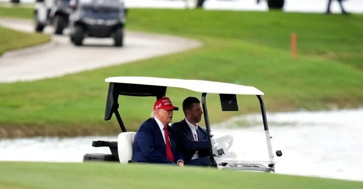 As stock market plunges over tariffs, Trump takes in the greens at his golf course