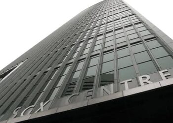 Singapore trades flat as investors await global cues