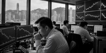 Asian markets open mixed as Hong Kong slides and Singapore rallies